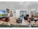 Open living room with comfortable seating and lake view at 7836 Crosswinds Way, Mount Dora, FL 32757