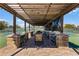Relaxing pergola covers outdoor pickleball courts at 7836 Crosswinds Way, Mount Dora, FL 32757