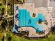 Relaxing pool area with ample lounge chairs and palm trees at 7836 Crosswinds Way, Mount Dora, FL 32757