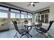 Relaxing screened patio with lake view and outdoor furniture at 7836 Crosswinds Way, Mount Dora, FL 32757