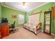 Charming bedroom with a daybed, built-in shelves, and a desk area at 8773 Silk Bay Pl, Orlando, FL 32827
