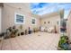Relaxing courtyard with tile patio and potted plants at 8773 Silk Bay Pl, Orlando, FL 32827