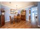 Bright dining area, featuring a wooden table and hutch at 8773 Silk Bay Pl, Orlando, FL 32827