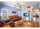 Relaxing living room with leather furniture and hardwood floors at 8773 Silk Bay Pl, Orlando, FL 32827
