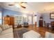 Spacious living room featuring hardwood floors and comfy furniture at 8773 Silk Bay Pl, Orlando, FL 32827