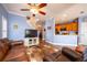 Comfortable living room, featuring a view into the kitchen at 8773 Silk Bay Pl, Orlando, FL 32827