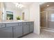 Modern bathroom with double vanity and a walk-in shower at 8906 Zurich Ln, Kissimmee, FL 34747