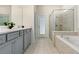 Elegant bathroom with double vanity, soaking tub, and walk-in shower at 8906 Zurich Ln, Kissimmee, FL 34747