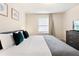 Spacious bedroom featuring a king-size bed and large window at 8906 Zurich Ln, Kissimmee, FL 34747