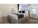 Bedroom with a comfy bed, nightstand and en-suite bathroom at 8906 Zurich Ln, Kissimmee, FL 34747