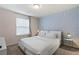 Bedroom with a king-size bed and stylish geometric wall at 8906 Zurich Ln, Kissimmee, FL 34747