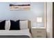 Bedroom with a queen bed, nightstand, and blue accent wall at 8906 Zurich Ln, Kissimmee, FL 34747
