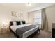 Spacious bedroom with a king-size bed and window blinds at 8906 Zurich Ln, Kissimmee, FL 34747