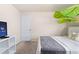 Relaxing bedroom with a queen bed and a TV at 8906 Zurich Ln, Kissimmee, FL 34747
