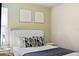 Charming bedroom with a queen-size bed and green walls at 8906 Zurich Ln, Kissimmee, FL 34747