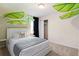 Quaint bedroom with a unique leaf decor and a queen bed at 8906 Zurich Ln, Kissimmee, FL 34747