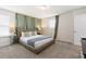 Spacious bedroom featuring a king-size bed and neutral color palette at 8906 Zurich Ln, Kissimmee, FL 34747