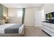 Bedroom with king-size bed, dresser, and smart TV at 8906 Zurich Ln, Kissimmee, FL 34747