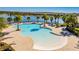 Relaxing community pool with a unique shape and plenty of lounge chairs at 8906 Zurich Ln, Kissimmee, FL 34747