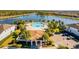 Resort-style community pool with a clubhouse and lake views at 8906 Zurich Ln, Kissimmee, FL 34747