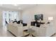 Bright living room with comfortable seating and a large TV at 8906 Zurich Ln, Kissimmee, FL 34747