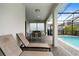 Relaxing poolside patio with lounge chairs and outdoor dining area at 8906 Zurich Ln, Kissimmee, FL 34747