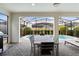 Outdoor patio with pool, table, and grill at 8906 Zurich Ln, Kissimmee, FL 34747