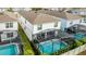 Screened-in rectangular pool with spa at 8906 Zurich Ln, Kissimmee, FL 34747