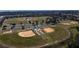 Aerial view of multiple baseball fields and parking lot at 9154 Harris Hawk Dr, Leesburg, FL 34788