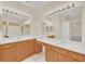 Double vanity bathroom with wood cabinets and bright lighting at 926 Palm Oak Dr, Apopka, FL 32712