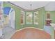 Kitchen nook with wood flooring and view of pool at 926 Palm Oak Dr, Apopka, FL 32712