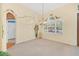 Bright dining room with decorative wall art and large window at 926 Palm Oak Dr, Apopka, FL 32712