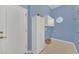 Laundry room with storage cabinets and window at 926 Palm Oak Dr, Apopka, FL 32712