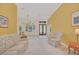 Living room with floral sofa and view to dining area at 926 Palm Oak Dr, Apopka, FL 32712