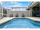Enjoy your own private pool and patio area with seating at 1046 Splash Shot Pl, Davenport, FL 33896