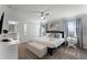 Spacious primary bedroom with king-size bed and en-suite bathroom at 1046 Splash Shot Pl, Davenport, FL 33896