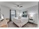Bedroom with queen bed and geometric patterned wall at 1046 Splash Shot Pl, Davenport, FL 33896