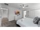 Bright bedroom with a queen-size bed and access to a hallway bathroom at 1046 Splash Shot Pl, Davenport, FL 33896