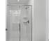 Clean shower with glass enclosure and built in shelves at 1046 Splash Shot Pl, Davenport, FL 33896