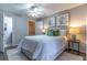 Cozy bedroom with a plush rug, stylish decor, and an ensuite bathroom at 1057 S Hiawassee Rd # 1911, Orlando, FL 32835