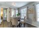 Charming dining area with a round table and four chairs at 1057 S Hiawassee Rd # 1911, Orlando, FL 32835