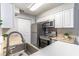 Clean and bright kitchen with stainless steel appliances and granite countertops at 1057 S Hiawassee Rd # 1911, Orlando, FL 32835