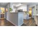 Kitchen with white cabinets, stainless steel appliances and hard wood flooring at 1057 S Hiawassee Rd # 1911, Orlando, FL 32835
