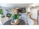 Open concept kitchen and living area with modern appliances and stylish decor at 1057 S Hiawassee Rd # 1911, Orlando, FL 32835