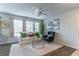 Comfortable living room with large windows, hardwood floors, and stylish modern decor at 1057 S Hiawassee Rd # 1911, Orlando, FL 32835