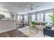 Cozy living room area with open floor plan, a dining table, and a ceiling fan at 1057 S Hiawassee Rd # 1911, Orlando, FL 32835