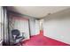 Bedroom with red carpet, window, and a mattress at 106 Seabreeze Cir, Kissimmee, FL 34743