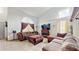 Living room with a fireplace, sectional sofa, and large TV at 106 Seabreeze Cir, Kissimmee, FL 34743