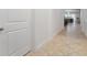 Bright hallway with tile flooring and modern door at 10824 Royal Cypress Way, Orlando, FL 32836