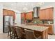 Gourmet kitchen features granite countertops, stainless steel appliances, and custom cabinetry at 10824 Royal Cypress Way, Orlando, FL 32836